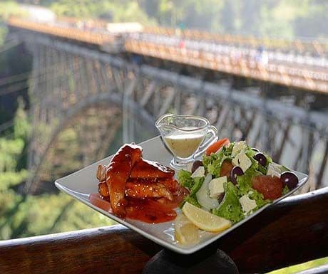 Riverside dining in Victoria Falls at dusk.